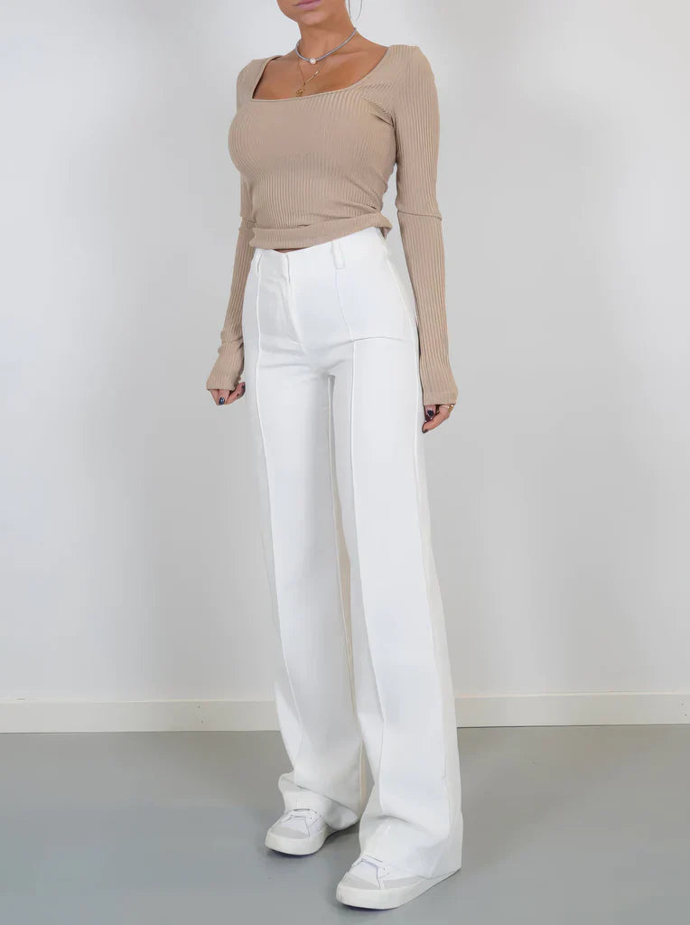 High-waisted women's trousers with straight legs and a smooth woven fabric finish