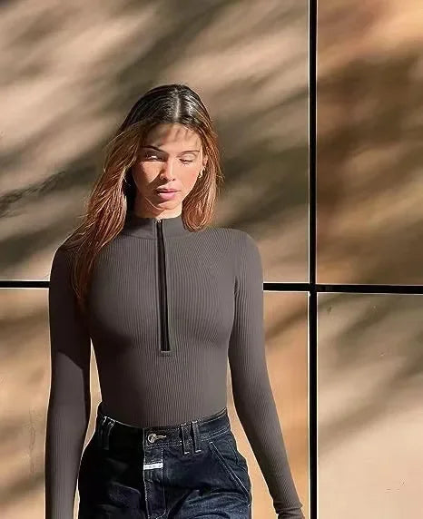 Women's long-sleeve polyamide-blend bodysuit with zipper, form-fitting shapewear with ribbed surface detail