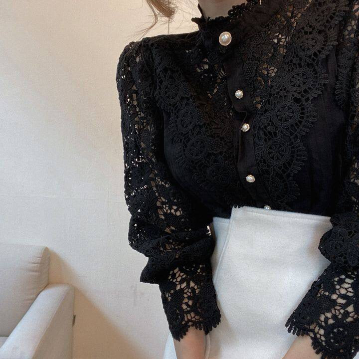 Elegant women's lace blouse with long sleeves, high neckline, and structured silhouette