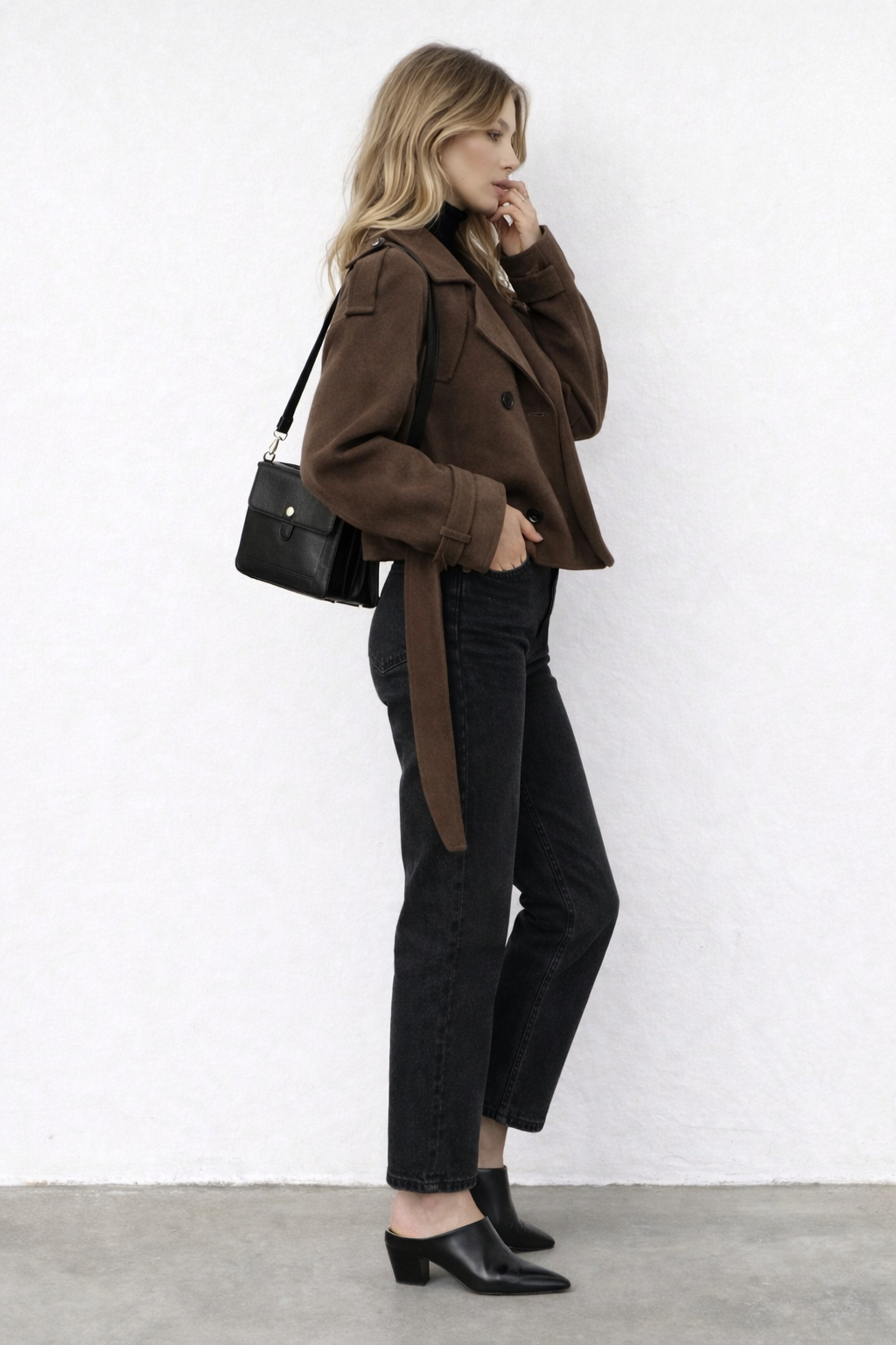 Short women's coat with adjustable belt and clean seam panel detailing