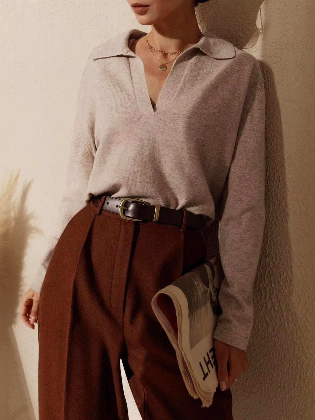 Relaxed fit women's knitted sweater top with long sleeves and V-neckline