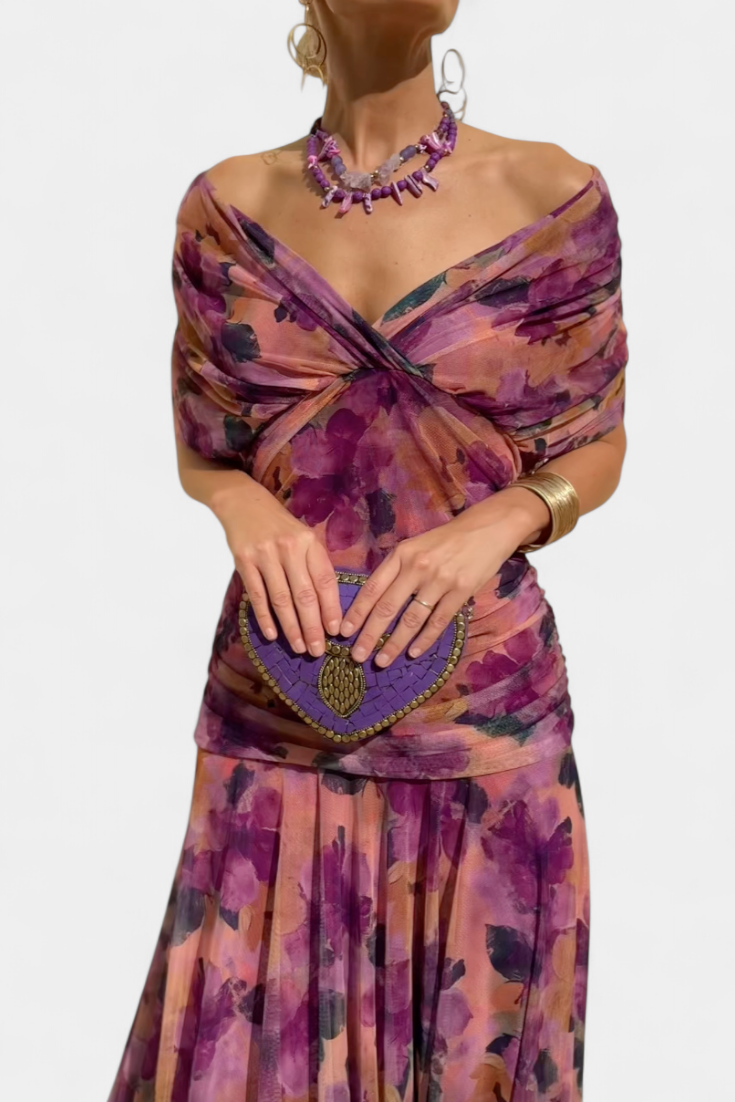 Off-shoulder maxi dress with gathered waist and full-length flowing skirt