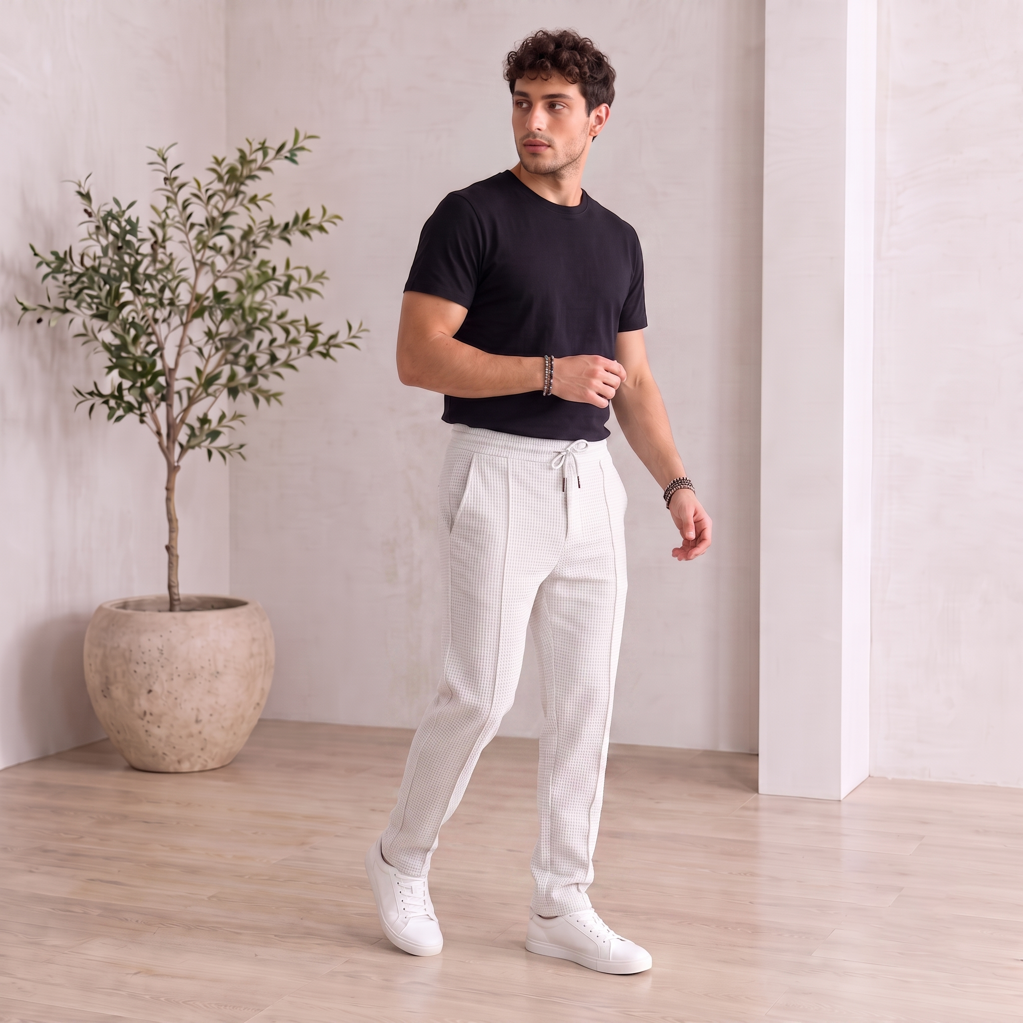 Men's drawstring trousers with structured woven texture and tapered leg