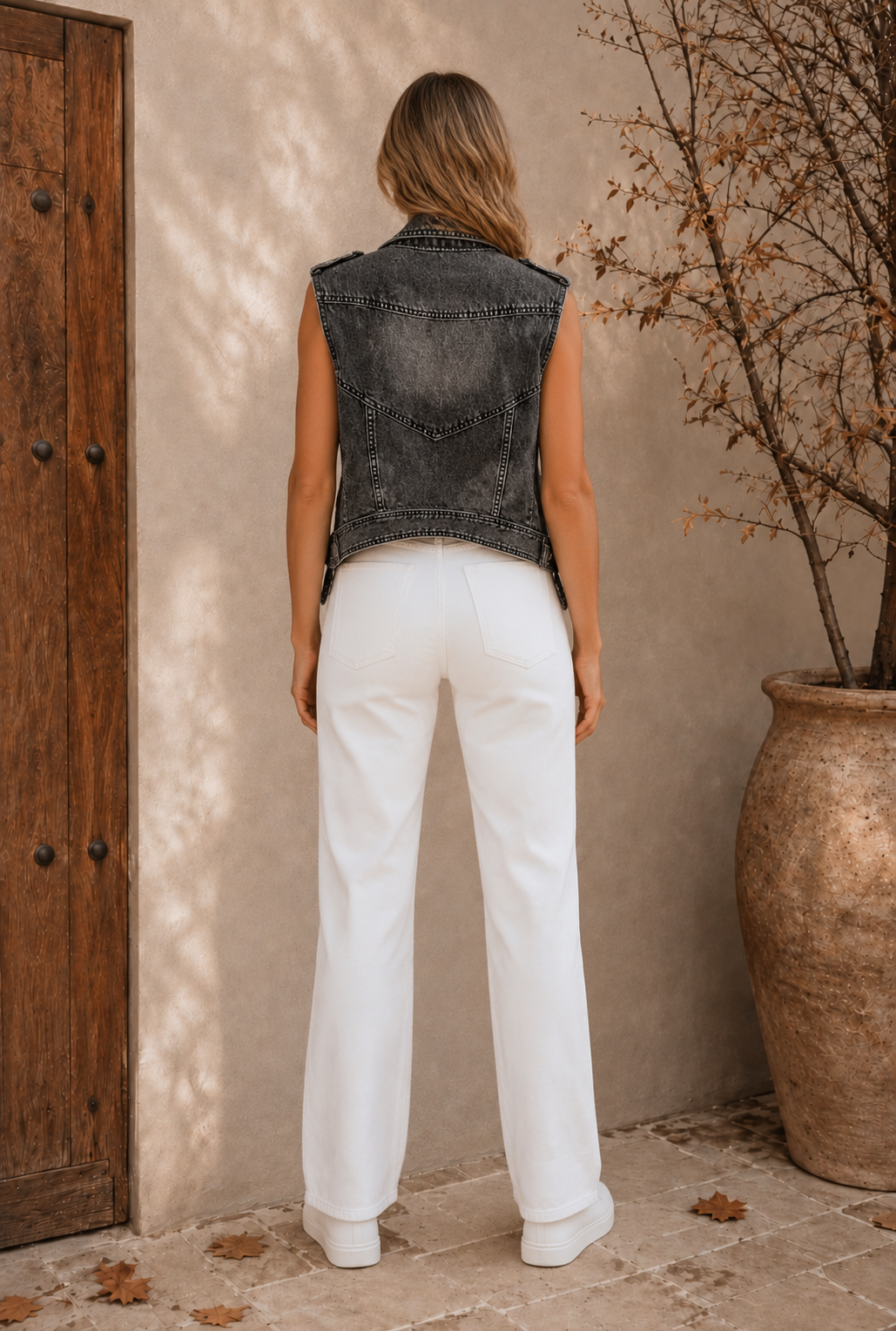 Close-up of dark gray denim bodywarmer lapel collar and neckline