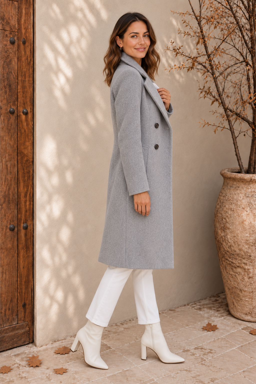 Women's light grey tailored coat, side view showing knee length