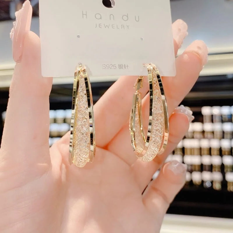Lightweight metal hoop earrings with structured textured finish
